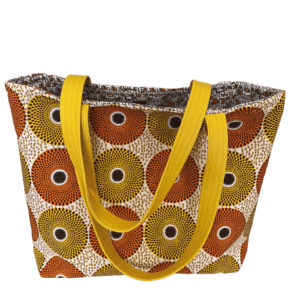 Gorgeous Travel Tote Bag. African Bullseye Fabric. Vegan Leather Strap. Eight Pockets. Magnetic Snap Enclosure. One of a Kind.