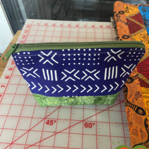 Gorgeous Designer Cosmetic/Jewelry Bag. Made with African Mud Cloth and Indonesian Batik. One of a Kind. Great for Gift Giving.