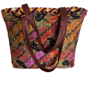 This travel tote bag is hand made by me and is one of a kind. I use Designer or Vintage fabrics for all of my bags, including the bag linings. This bag is made of a vintage Shamash & Sons African themed fabric. The lining fabric is a coordinated African Ankara fabric. There are eight pockets and a magnetic snap enclosure. The straps are sturdy and are made of a metallic brown vegan leather. This is a gorgeous bag. Made with love. Dimensions: Bag - 20" W x 17" L x 5" D, Shoulder Strap Clearance - 14" L Easy Care: Instructions for care will be sent along with the bag. From my smoke free and pet free studio to you. Please ask questions. Thank you for browsing my shop.